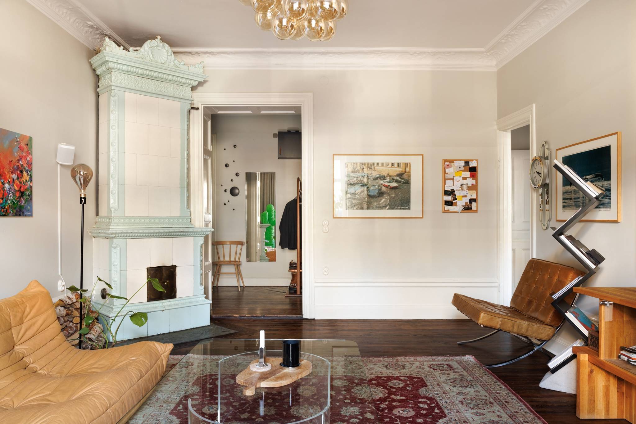 living room with Togo sofas and Barcelona chair 1960s vintage decor